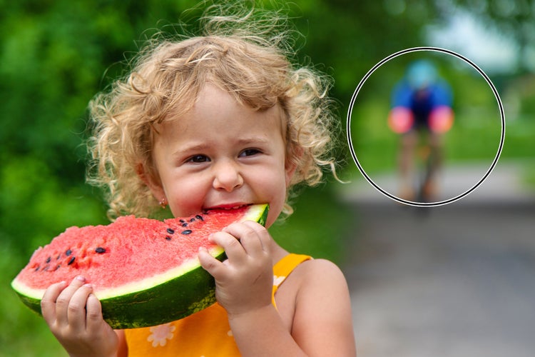 Little girl eating watermelon.