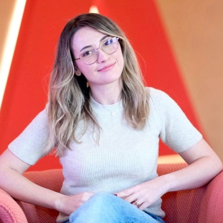 A person sitting in a chair AI-generated content may be incorrect.
