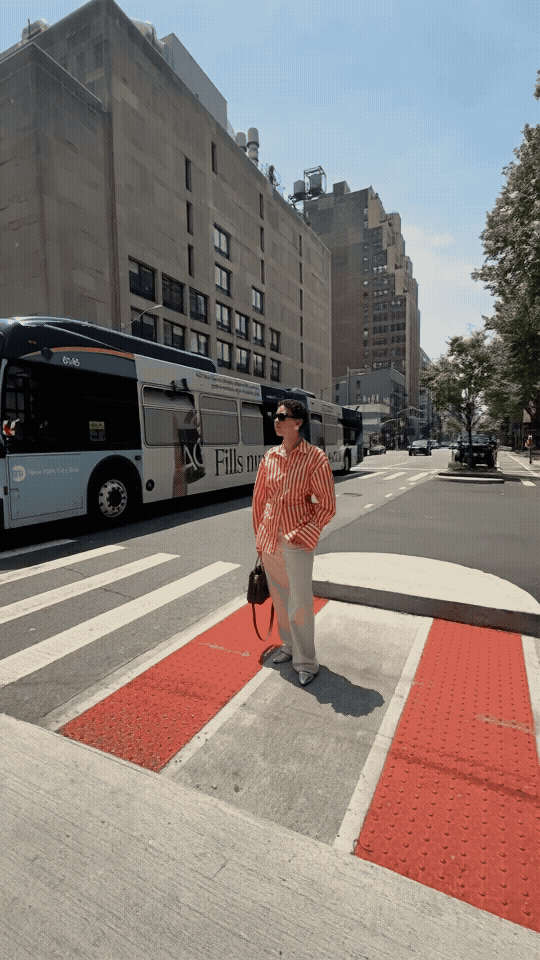 GIF of a woman in a crosswalk.