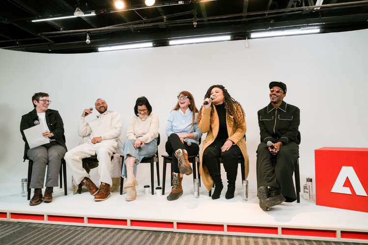 Group of people from Adobe on stage.