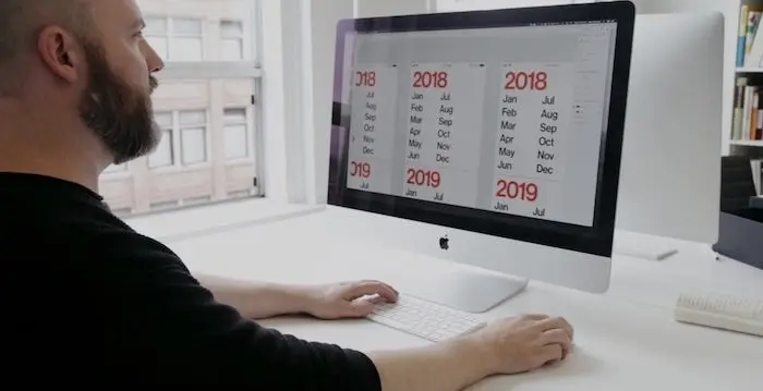 A side profile of Sean Wolcott, designing the Minimal Calendar App in Adobe XD.