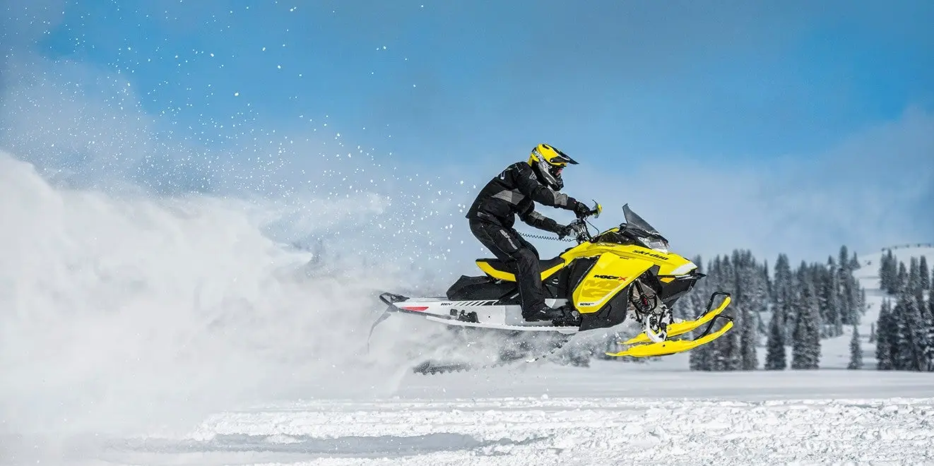 Snowmobile rider catching some air