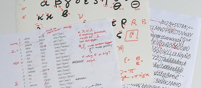 A stack of papers with handwriting on them.