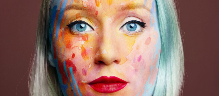 Image of colorfully painted woman by photographer Flora Borsi.