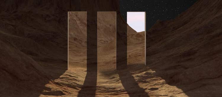 A 3D design of portals in a desert landscape at night time leading to an alternate reality of the same world in the daytime.