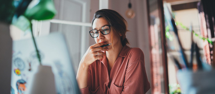 Young businesswoman thinking about something while sitting front.