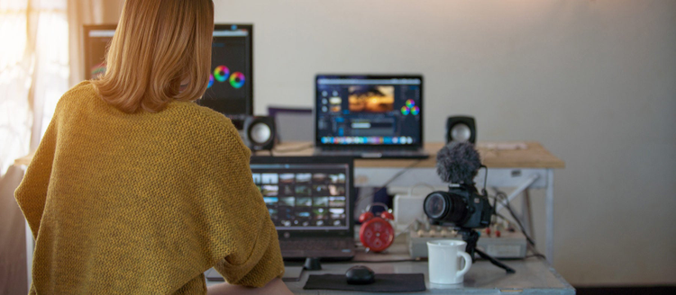 woman working with footage video on laptop and computer