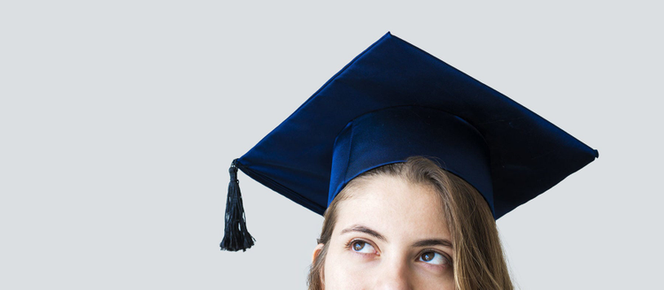 Young female student graduating from university