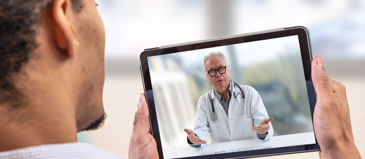 Telemedicine and health care concept with a young man and a doctor on computer screen