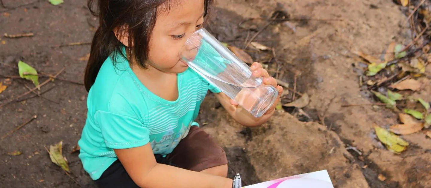 Girl drinking water.