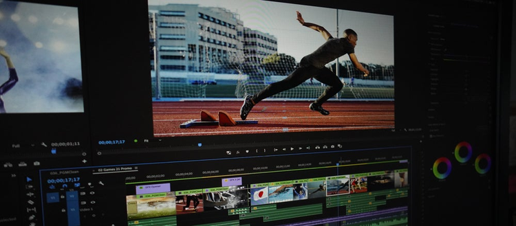 The Adobe Premiere Pro interface showing HDR content with a sprinter starting a race.