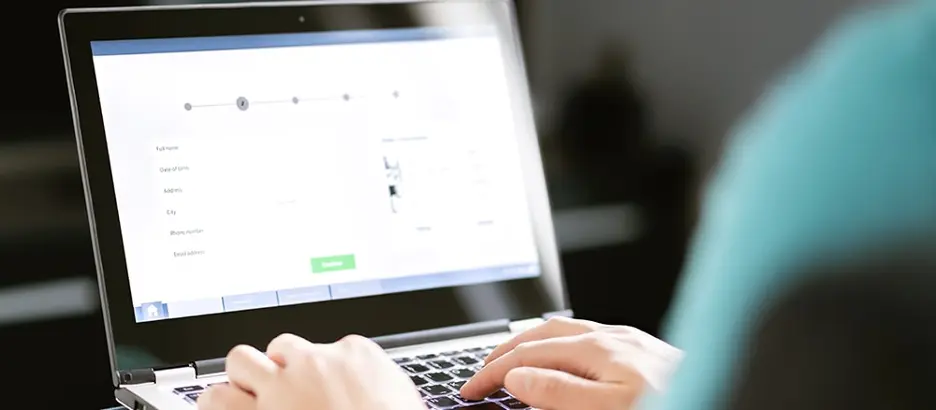 Person typing on laptop