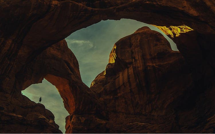 Looking up through rock formed arches.
