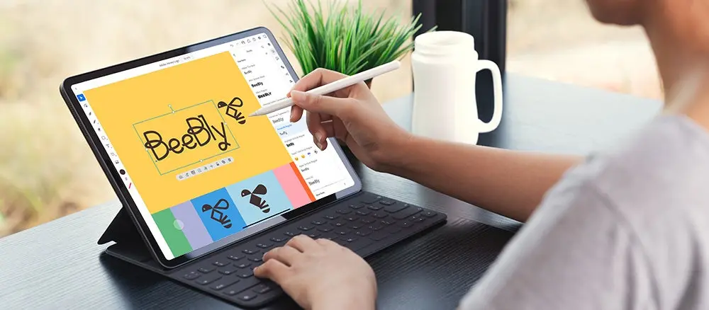 A user hovers their stylus over type on an iPad screen in the Illustrator for the iPad app.