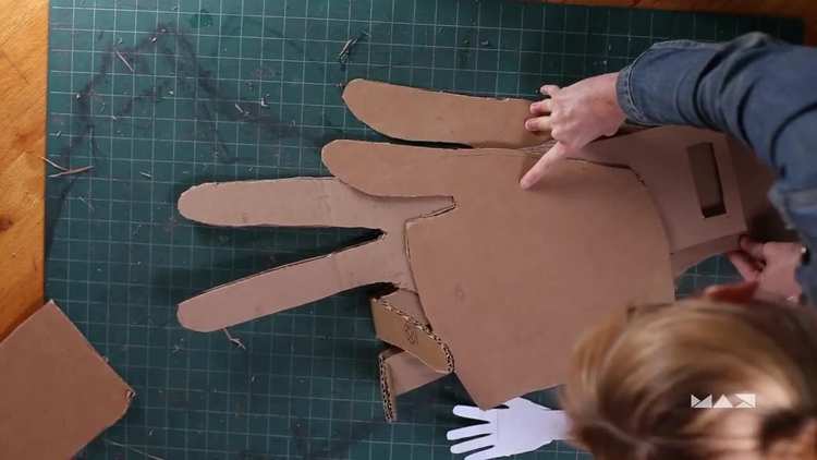 Cutout of hand in cardboard