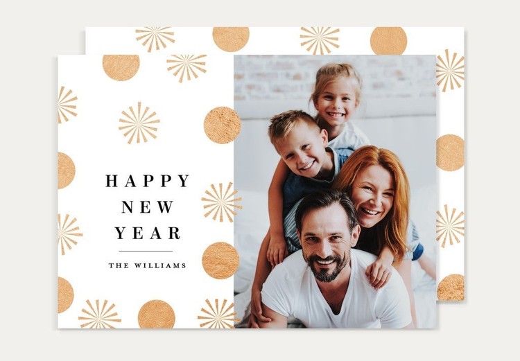 Happy New Year card with a family of four pictured.