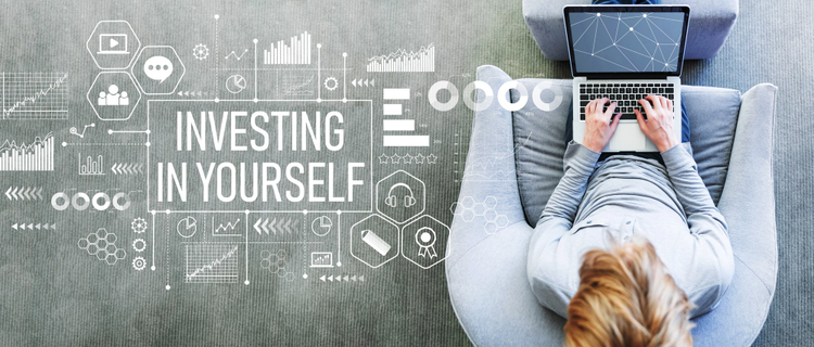 Person sitting with laptop and the text investing in yourself on a gray background. 
