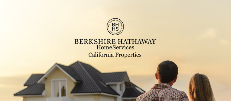 Berkshire Hathaway Home Servies California Properties. A couple looking at a yellow house. 