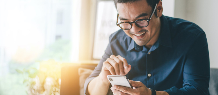 Consumer e-signing a document on his phone