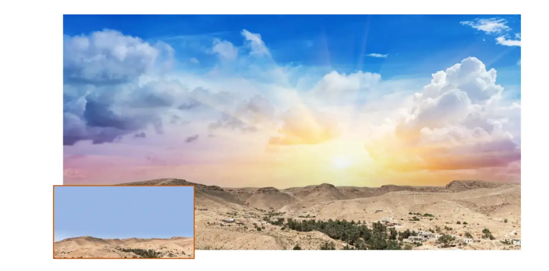 Photo of mountain range with a setting sun, blue sky, and clouds