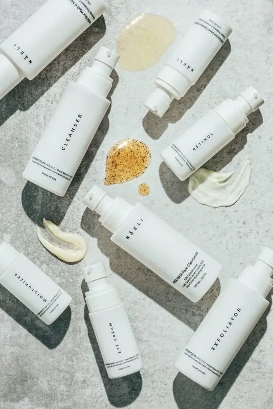 Photo of skincare line with products on cement