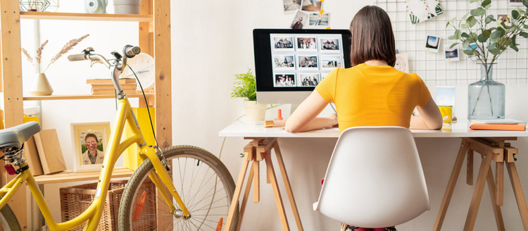 Creative professional working from home on an iMac.