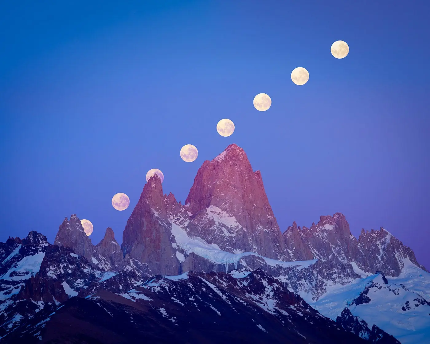 Photo showing different phases of the moon during the night moving over the mountains.