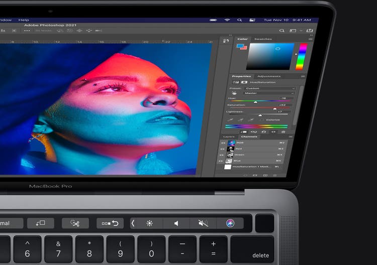 Photo of a macbook pro screen with photoshop opened on it.