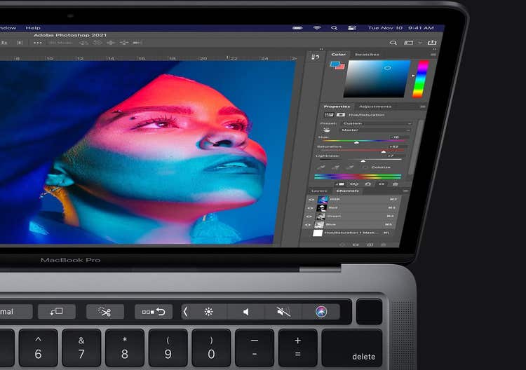 Photo of a macbook pro screen with photoshop opened on it.