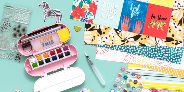 Colorful items strewn across turquoise background. 