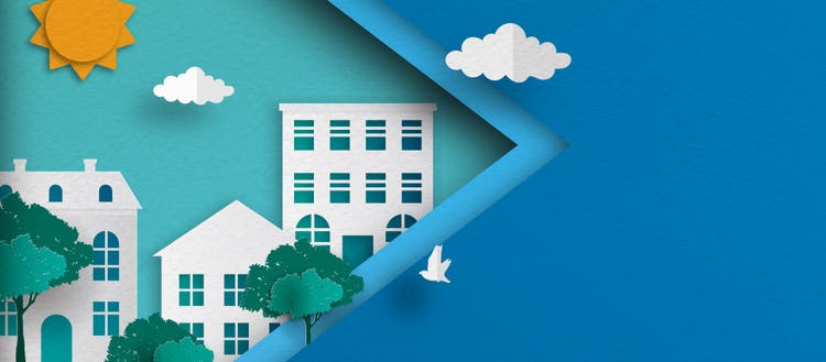 Digital image of cut out houses and trees surrounded by. blue sky.