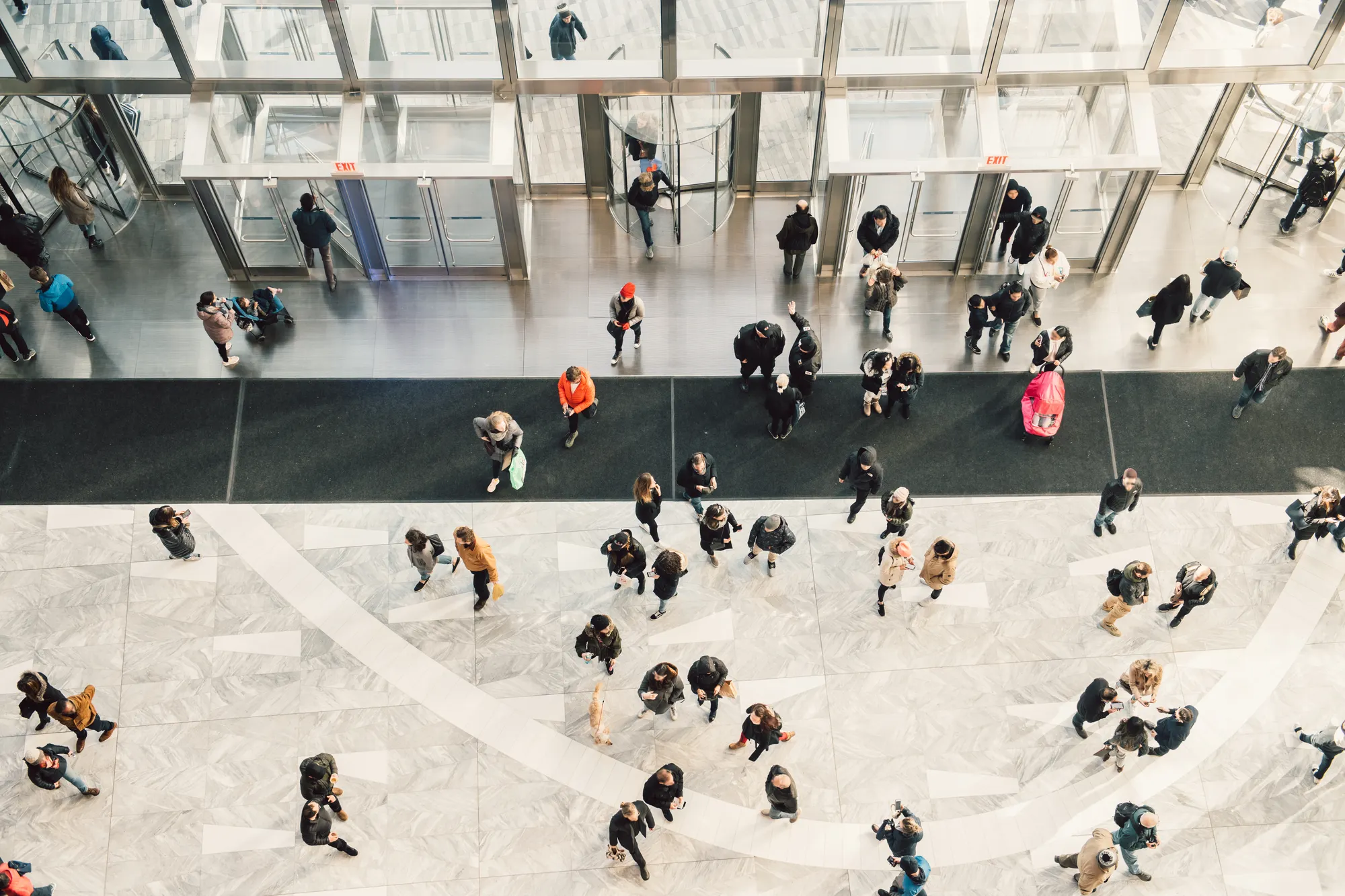 birds eye view of people walking in lobby of building