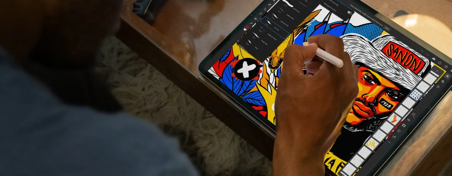 Person drawing on an ipad using Adobe Fresco.