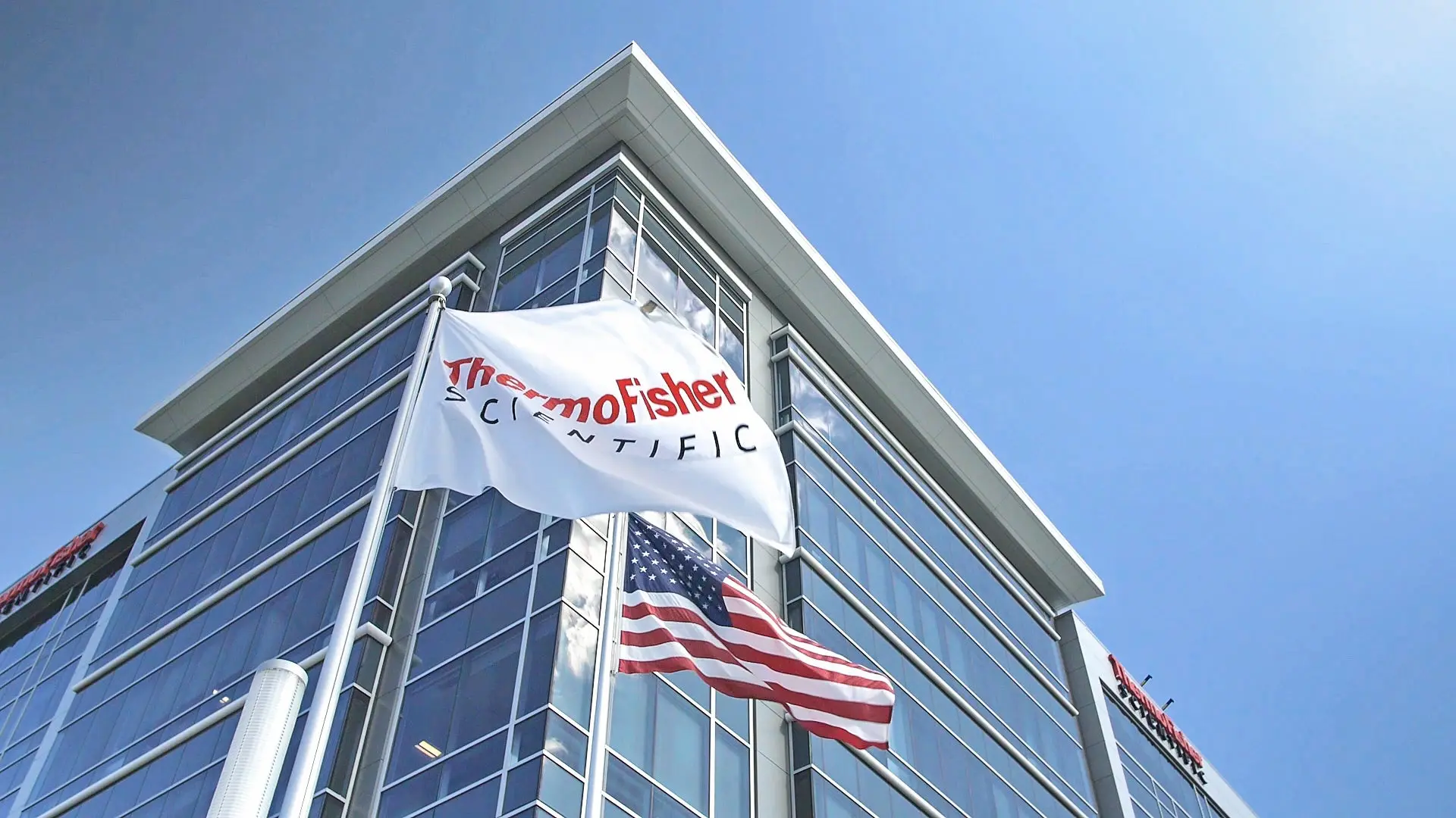 Outside of building with Thermo Fisher Scientific flag flying. 