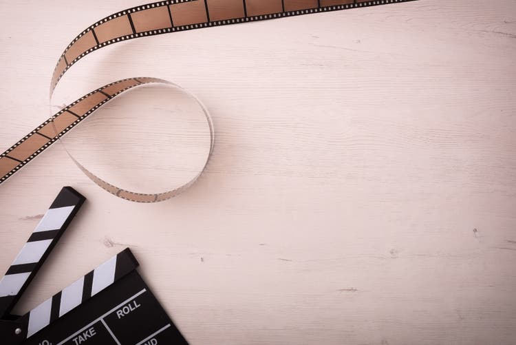 Image of film and reel from a movie set.