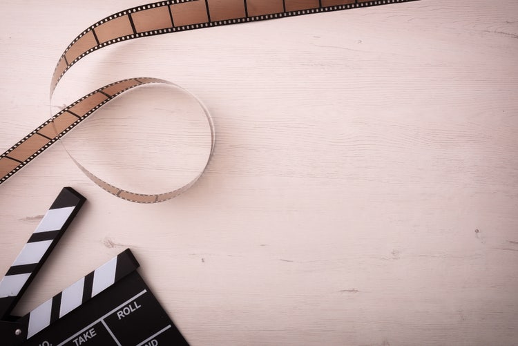 Image of film and reel from a movie set.