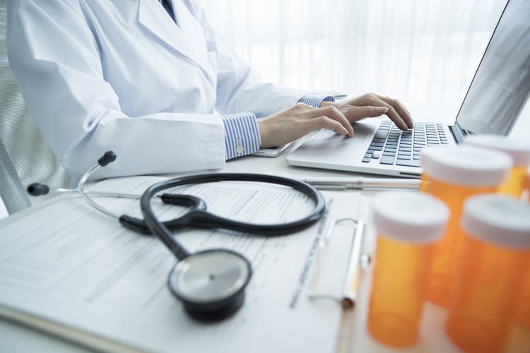 Doctor working on laptop