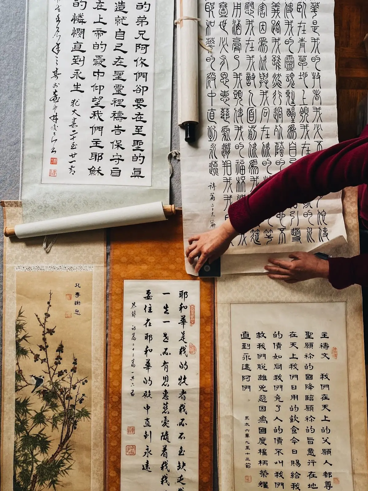 Image of rolls of paper with Chinese characters drawn on them. 