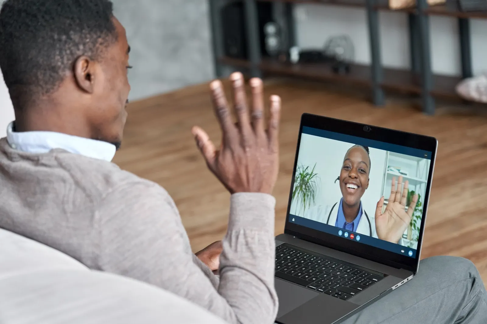Man having a video conference with his doctor.
