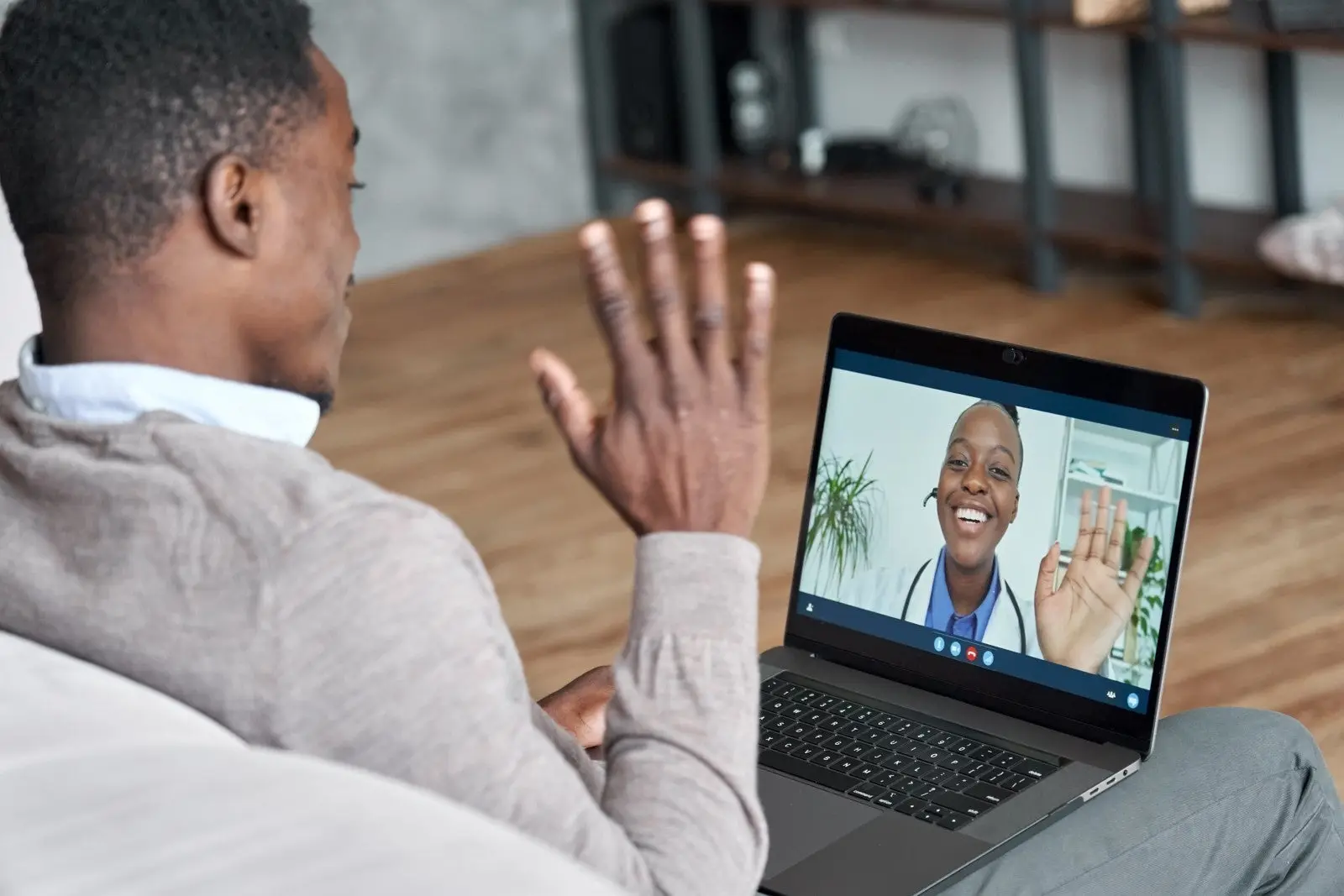 Man having a video conference with his doctor. 