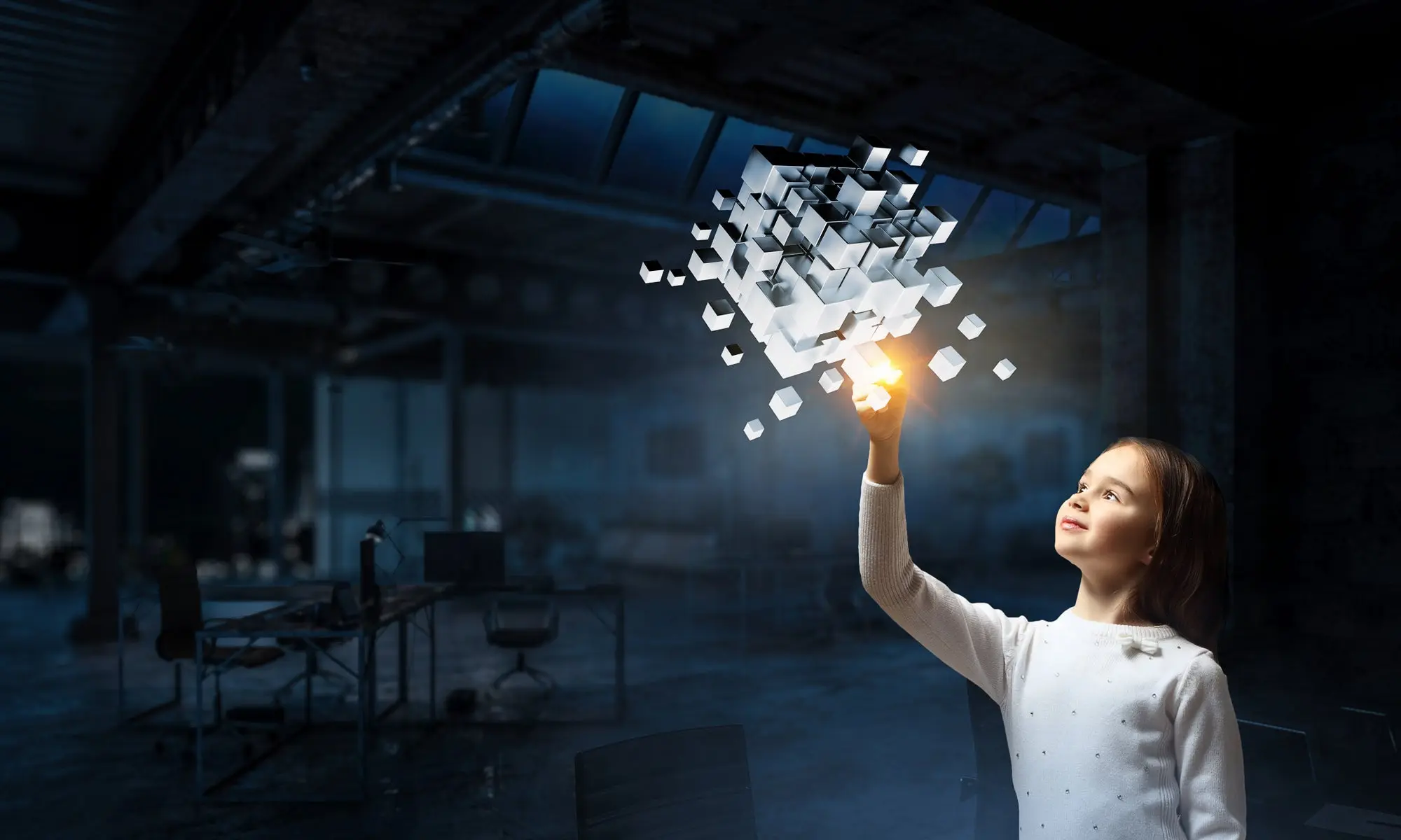 Small child touching cubes with light. 