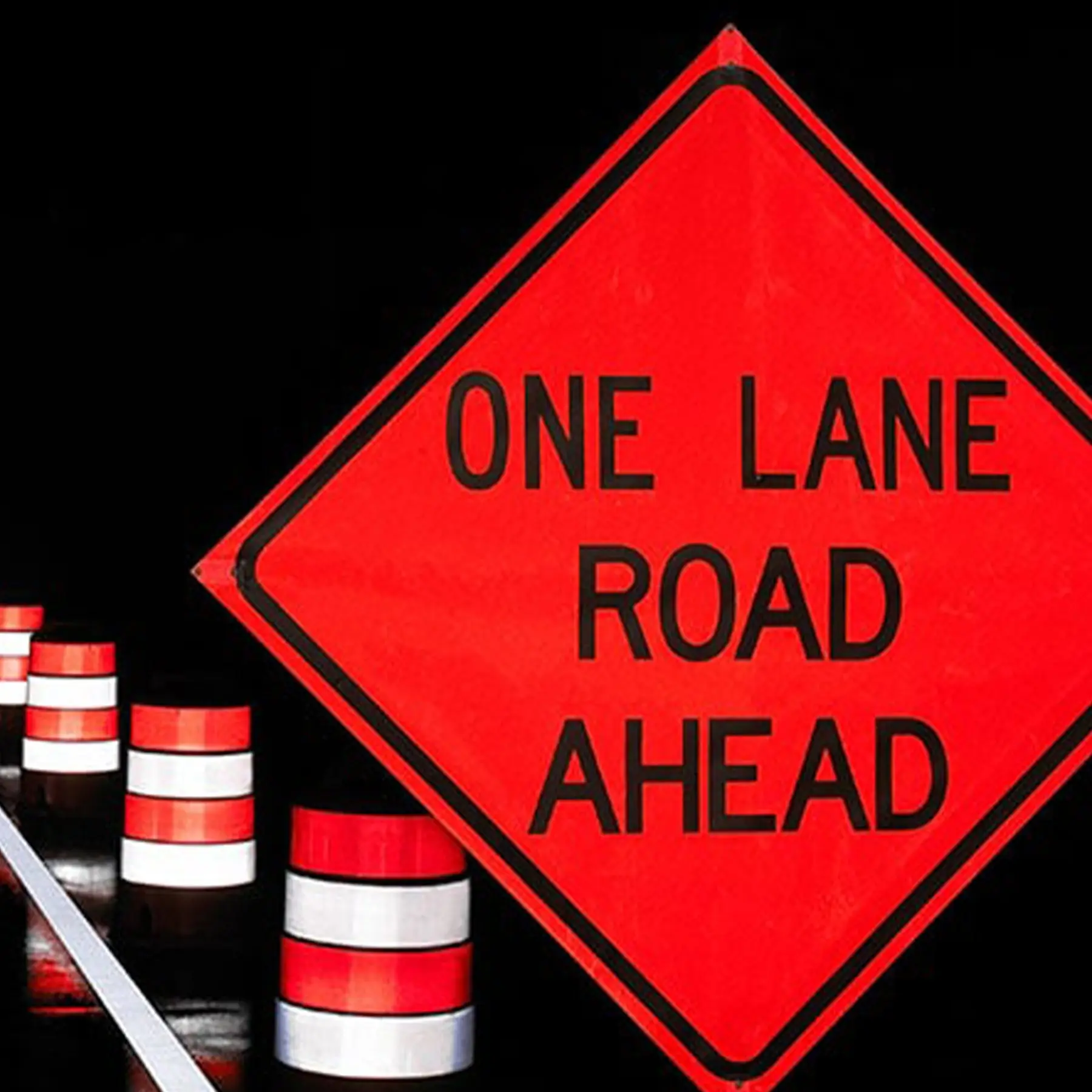 Road Sign saying "One Lane Road Ahead".