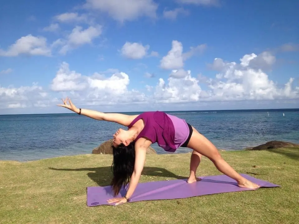 Jessica Koa practicing yoga. 