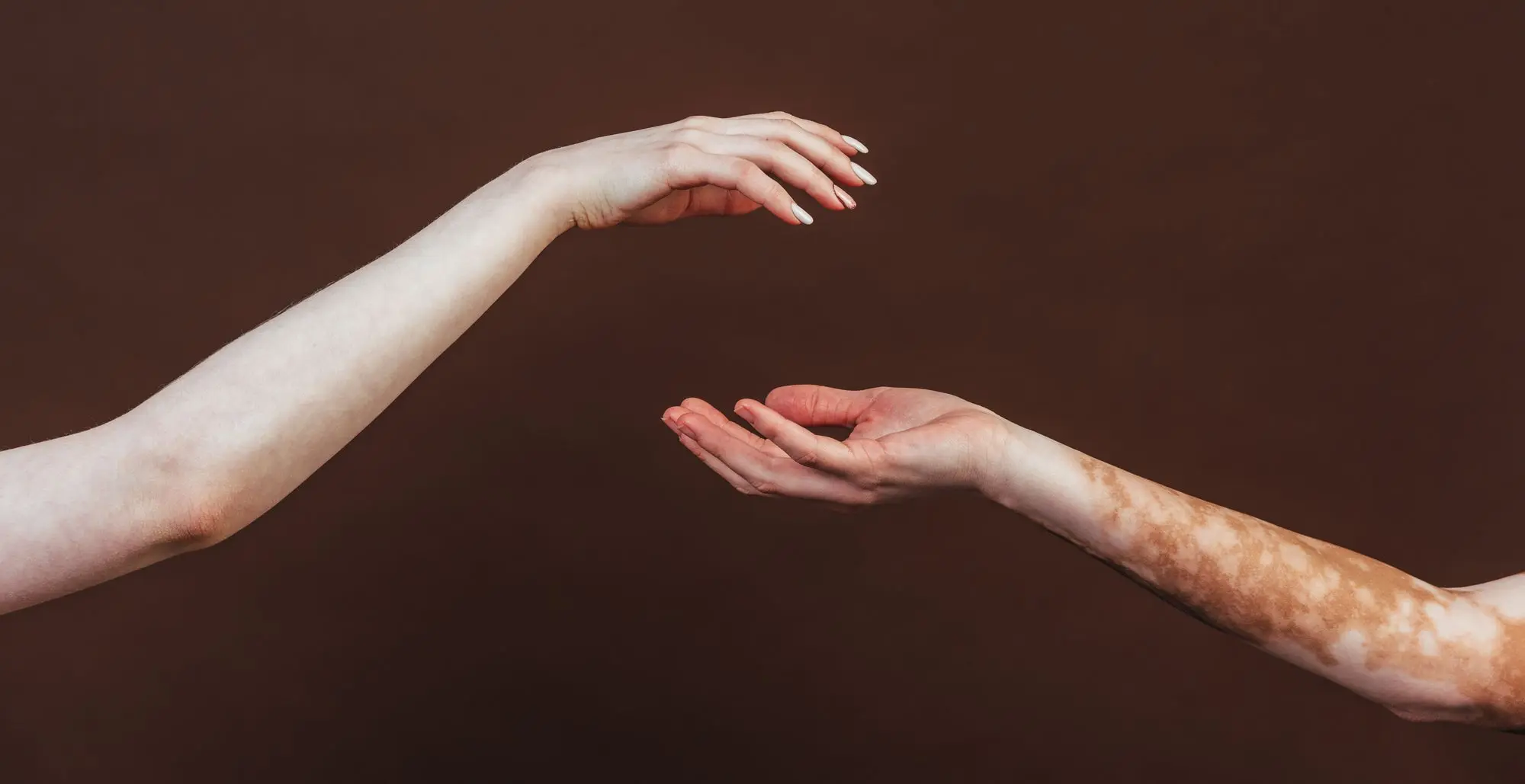 Image Of People Hands Against Black Background.