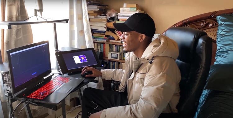 Image of Lwazi Msipha in his bedroom office.