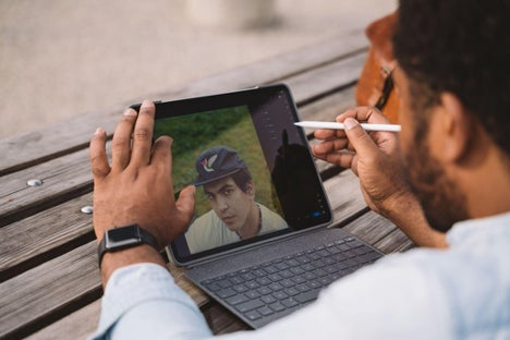 Image of Aundre Larrow editing on his Ipad. 