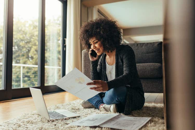 Woman working from her living room.