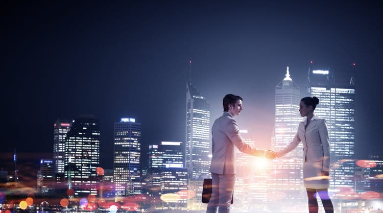 Business partnership, people shaking hands.