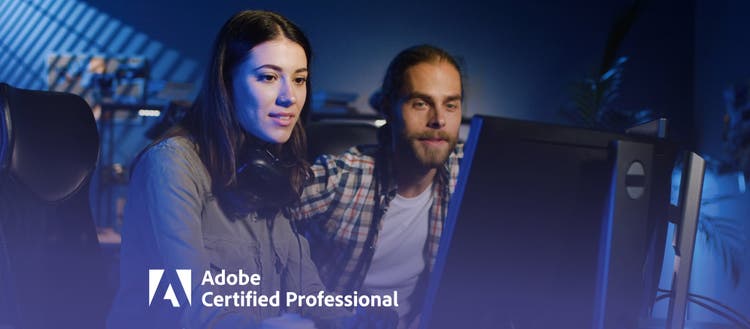 Two people looking at a computer screen.