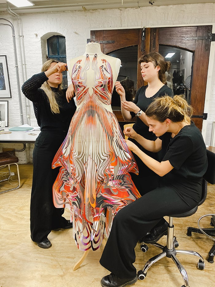 Iris van Herpen's design team creating a dress at her studio.